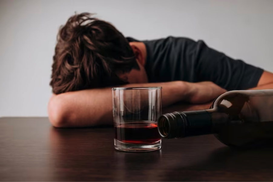 Teen male drunk off wine, clearly drank the entire bottle, and is in need of treatment.