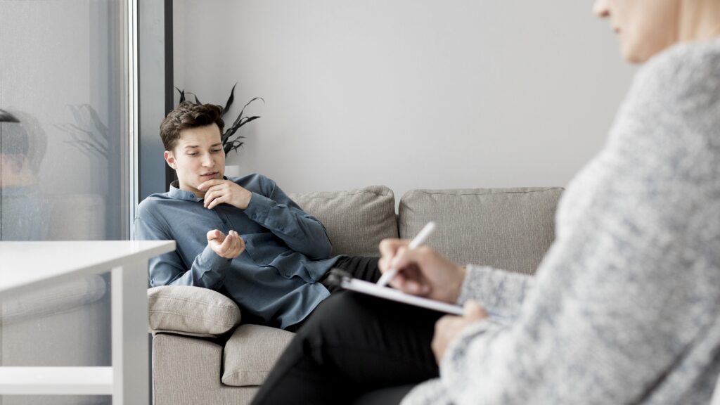 A male teen discusses with his therapist the reason why he uses drugs. 