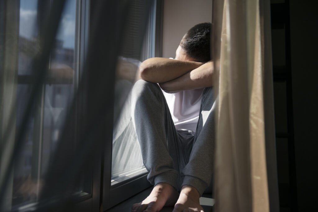 A male teen feeling the effects of depression and contemplating suicide; is in clear need of treatment. 