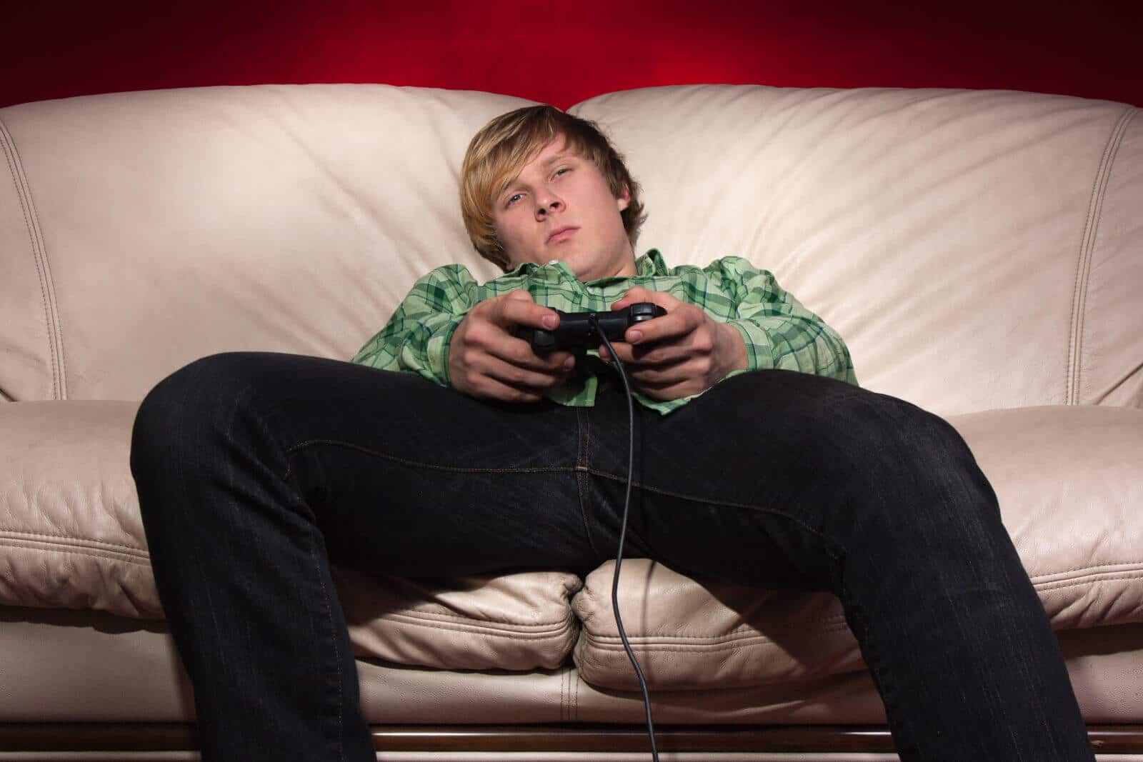 Male teen playing video games for more than 5 hours; in clear need of treatment.