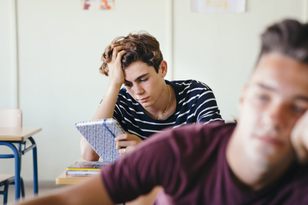 A male teen is in class but he is not paying attention; he is depressed. He is also suffering from substance abuse disorders, he is in clear need of treatment here at Clearfork Academy.
