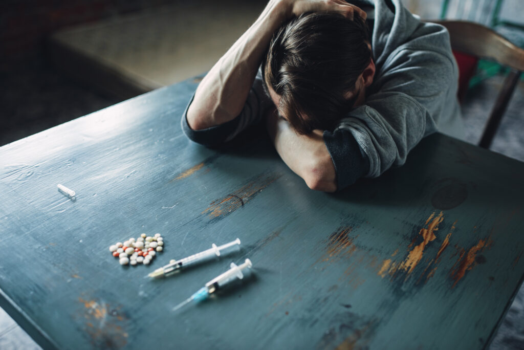A male teen feeling the effects of heroin in the body; is in clear need of treatment here at Clearfork. 