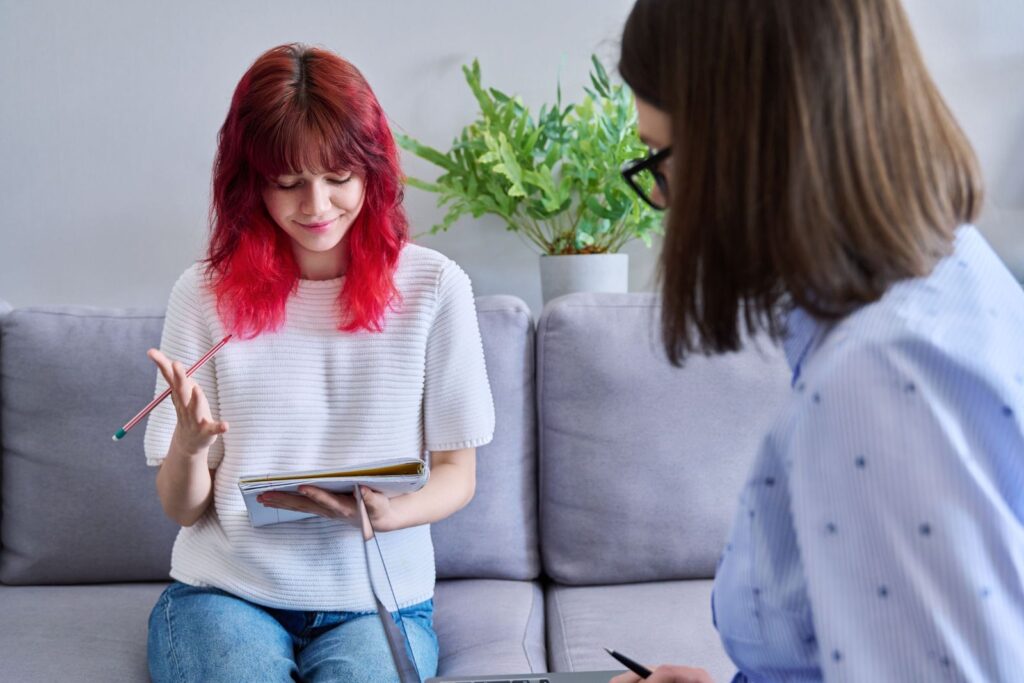 A female teen explains her emotions and opinions to her therapist. 