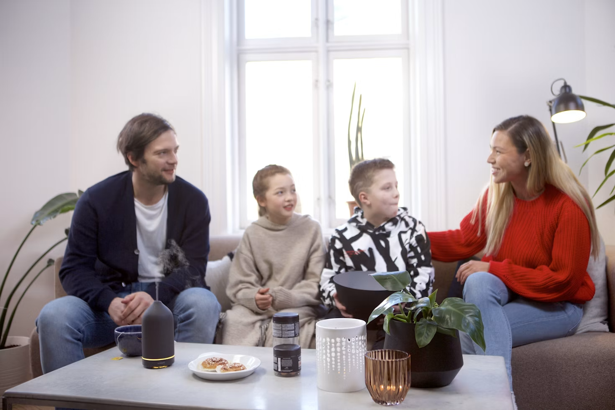 A family in a therapy session with their two young teens