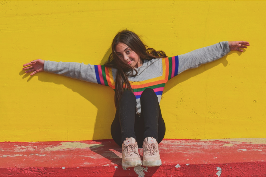 A teenager looking happy after completing a detox program in a residential treatment center.