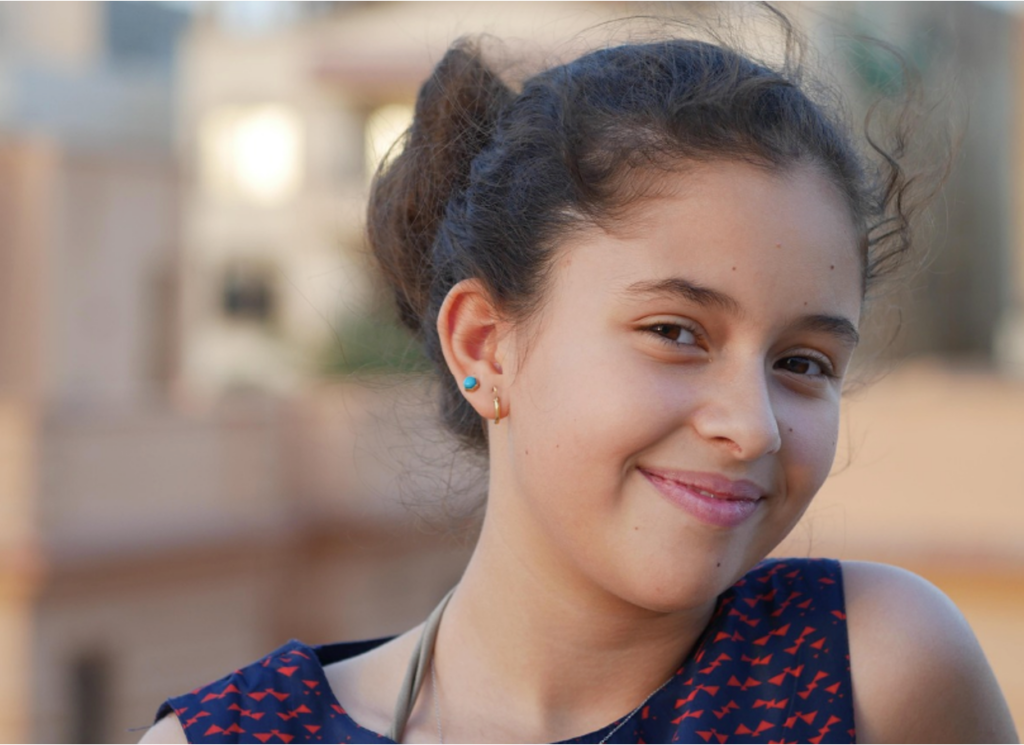 A teenager looking happy after going through therapy for behavioral modification