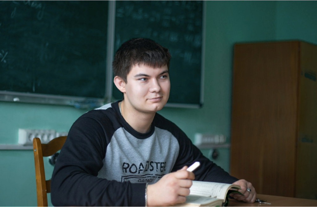 A young teenager participating in academic activities in a teen residential treatment center in Texas