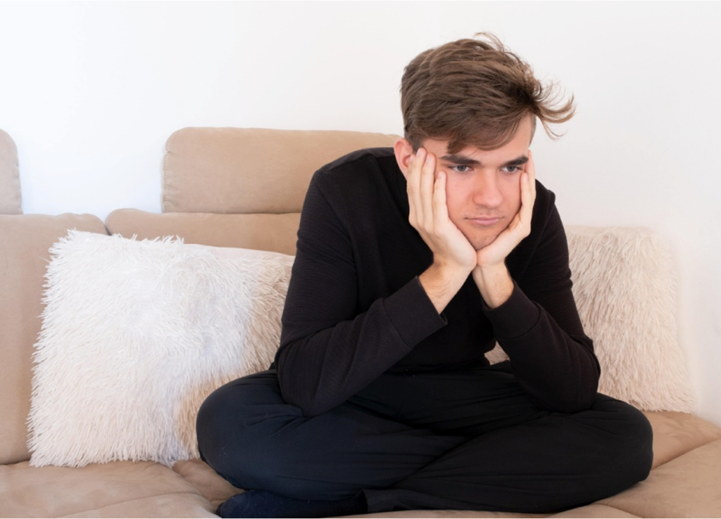 A teenager exhibiting mood swings as a result of nicotine withdrawal.