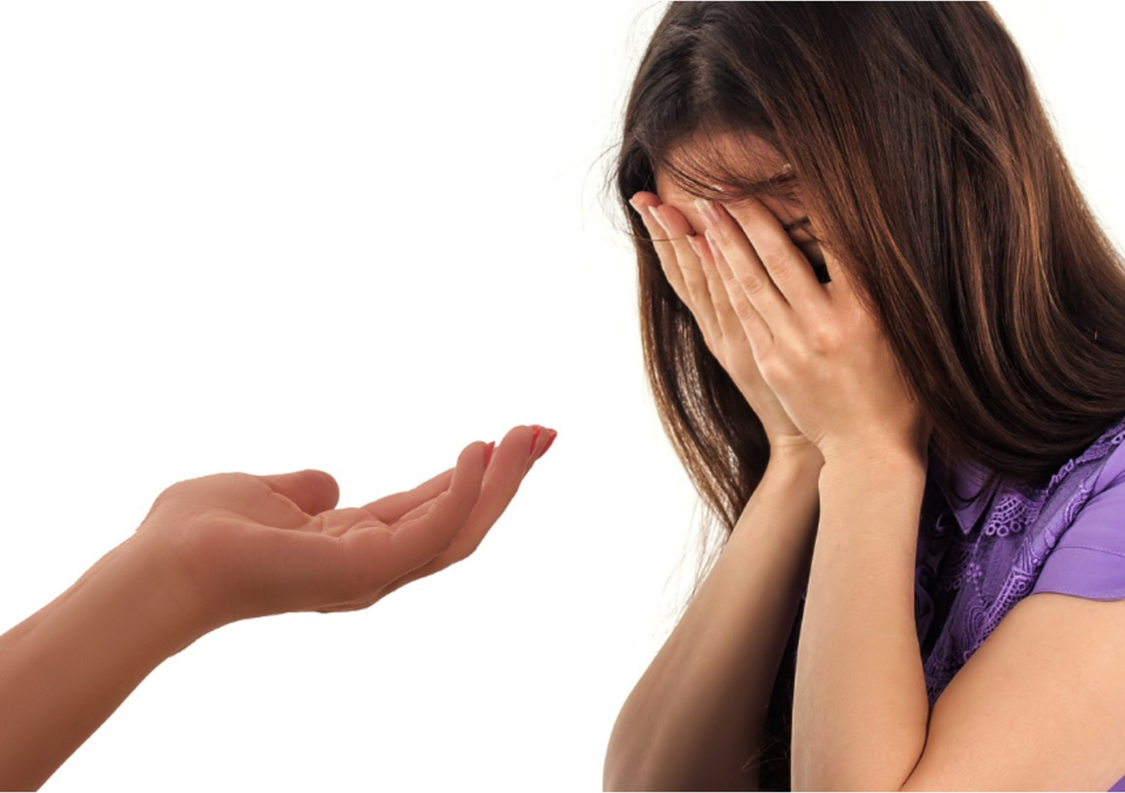 Parent and teen seated together having a calm conversation about boundaries at home