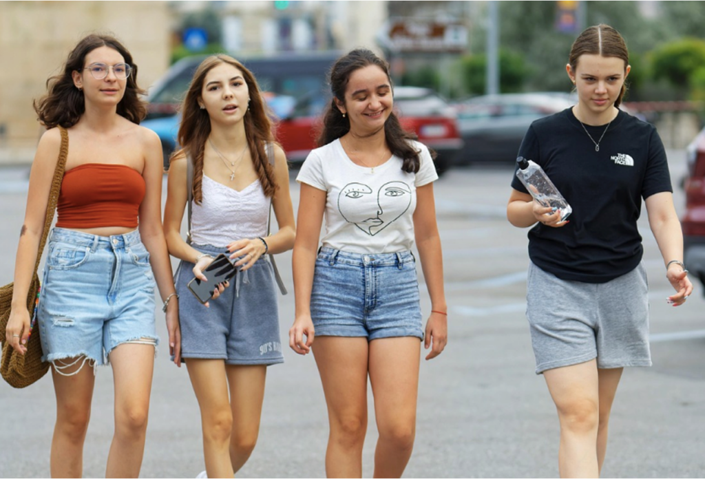 A group of happy teenagers enrolling in an IOP in Fort Worth, Texas