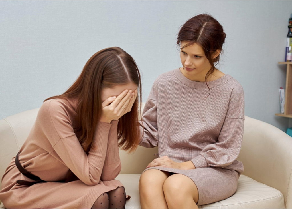 A parent speaking to their teen about their alcohol problem