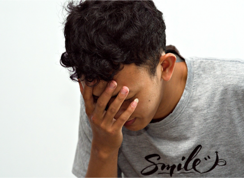 A person experiencing tremors as a result of anxiety