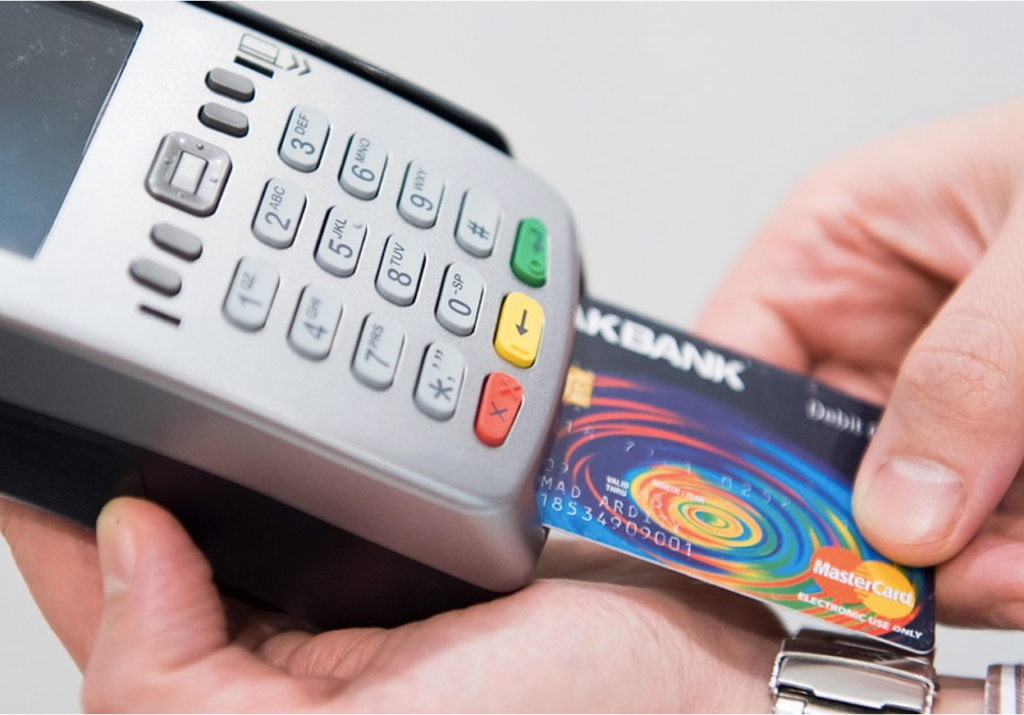 A person paying for a PHP for teens in Fort Worth using a credit card
