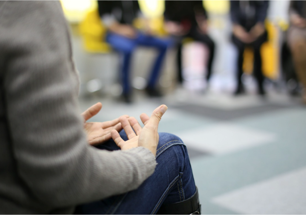 A support group for teenagers having a meeting