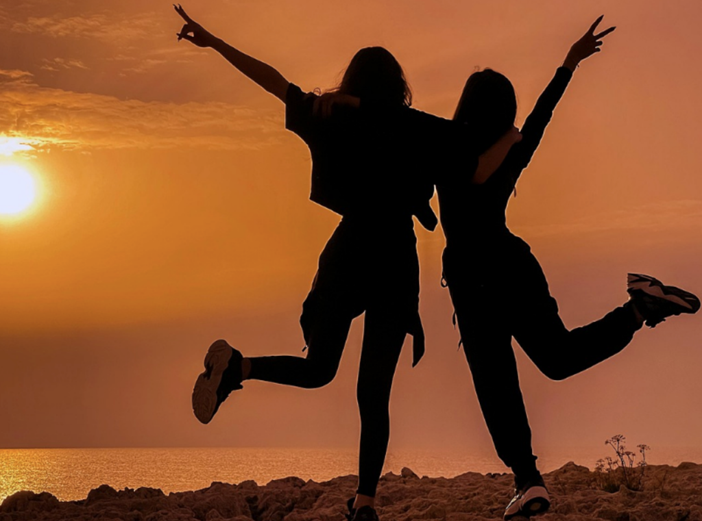 Happy teenagers rejoicing on the beach, showing recovery from addiction after participating in Clearfork Academy’s PHP program