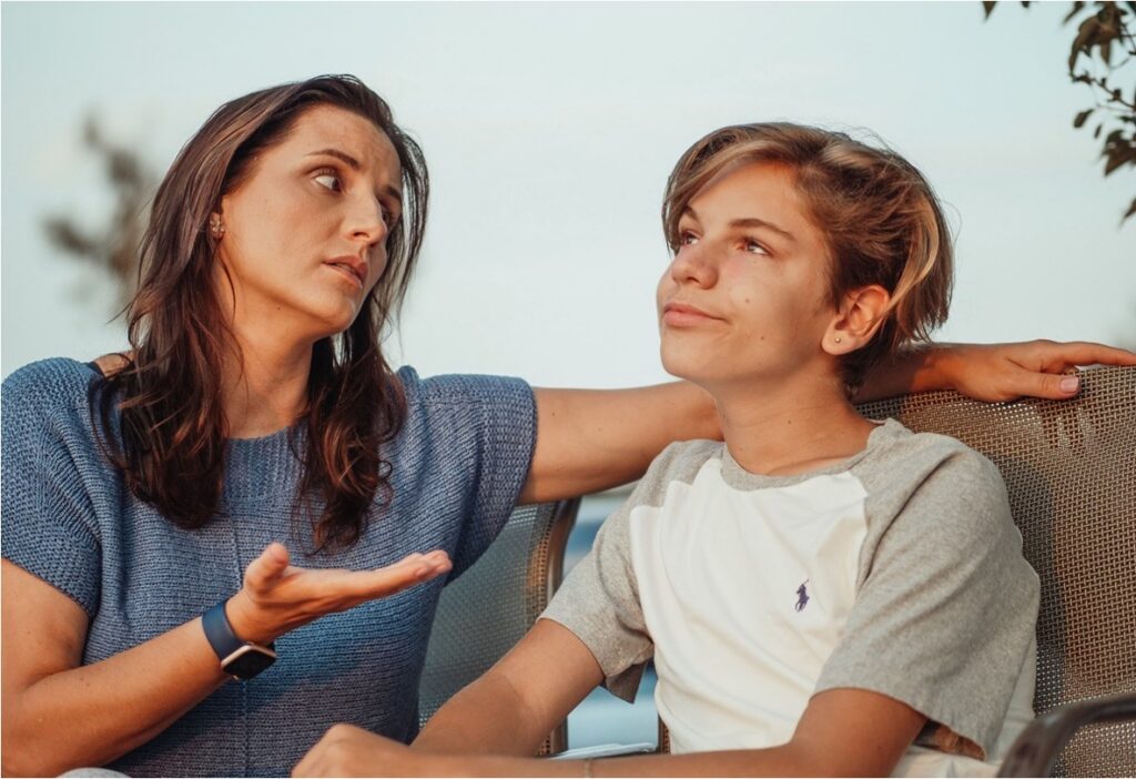 A mother checking in with her teenage son about how he's been feeling