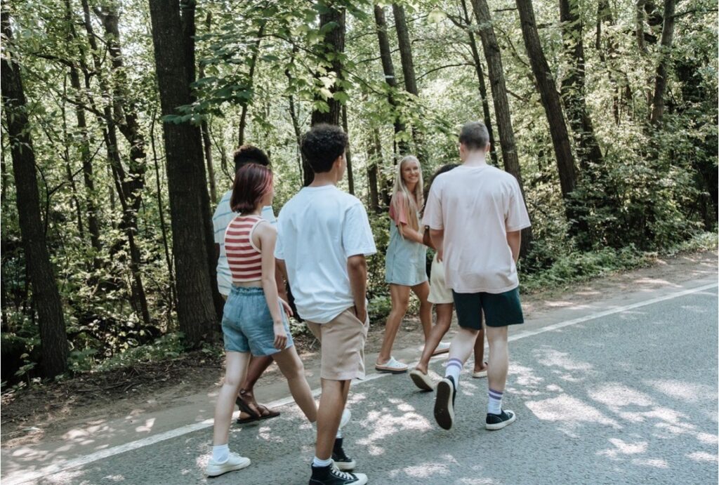 Teenagers walking and talking together, representing the return to daily life that antidepressants support