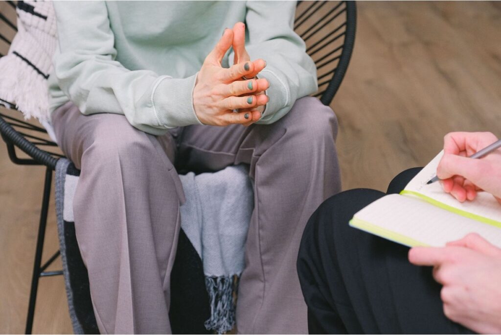 Closeup of a therapy session between a woman and a therapist