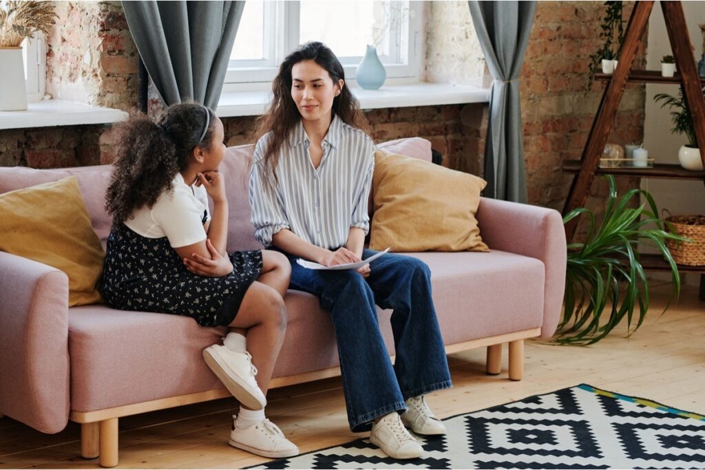 Teen girl in an individual therapy session with a female counselor